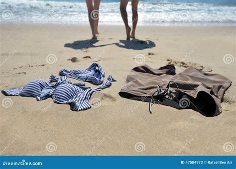 Couples at the nude beach - People take part in a traditional sea bathing to mark new-year's end on December 31, 2017 on a nudist beach in Le Cap d'Agde, southern France. / AFP... cap d'agde, herault, languedoc-roussillon,france - cap dagde stock pictures, royalty-free photos & images 